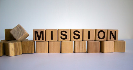 Concept word 'mission' on wooden cubes on a beautiful white background. Business concept.