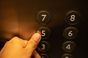 People pressing the elevator switch without protective equipment