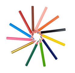 Fototapeta premium Round pattern made with many different colored wood pencil crayons on white