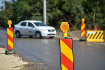 Yellow warning lights in a hazard zone during construction road works