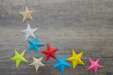 Fototapeta na wymiar Colorful origami stars on decoration