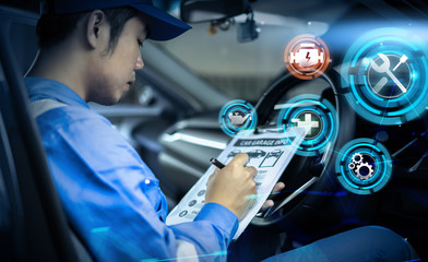 Mechanic engineer futuristic hologram icon repairing diagnosing checking motor vehicle car parts fixing issues problem broken engine, using clipboard pen man in professional uniform working in garage