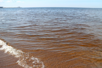 sandy coastal strip with waves