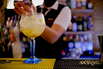 Bartender preparing cocktail at the cocktail bar. drinks concept
