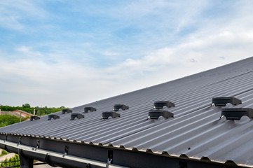 . Gutter system for a metal roof. Holder gutter drainage system on the roof. © Ахтем