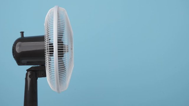 modern fan on a blue background. Copy space for text