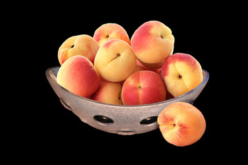Tasty apricots in a glass vase isolated on black