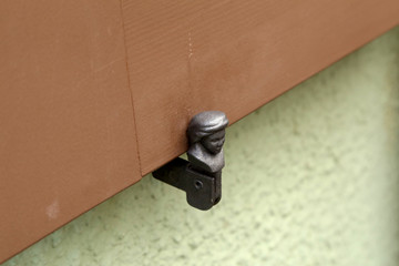 Antique metal window shutter holder in Germany