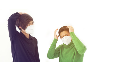 Two Asian diversity friends frustrated angry and worry from corona virus covid-19 wearing mask