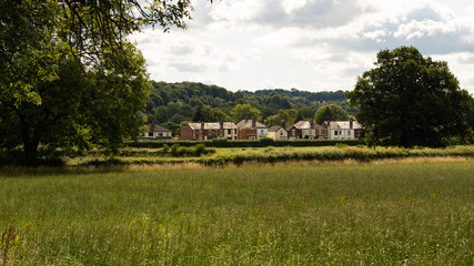 Obraz premium Houses across fields in Derbyshire village