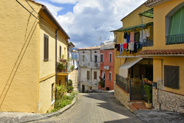 A narrow street among the old houses of Santa Maria del Cedro, a rural village in the Calabria region.