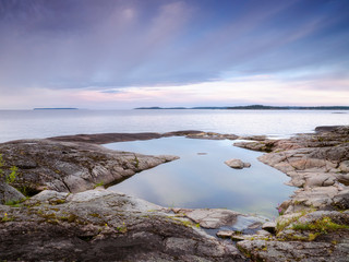 Island shore on lake Ladoga. Summer landscape. Wild nature