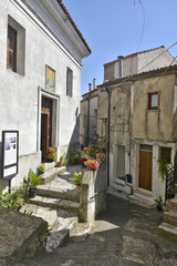 A narrow street among the old houses of Aieta, a rural village in the Calabria region.