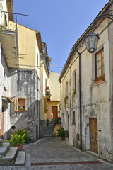 A narrow street among the old houses of Aieta, a rural village in the Calabria region.
