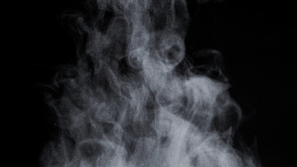 White Steam Ascends from Glass Pot, close-up.
