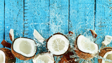 Freeze Motion Top Shot of Water Splashing on Coconut, close-up