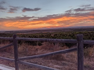 Fototapeta na wymiar sunset over the fence