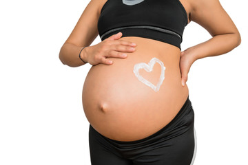 Pregnant woman with a drawn heart on belly.