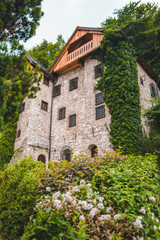 old stone building covered with climbing ivy
