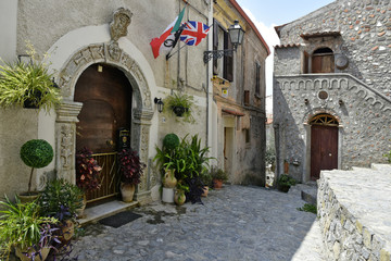 Fototapeta na wymiar A narrow street among the old houses of Scalea, a rural village in the Calabria region, Italy.