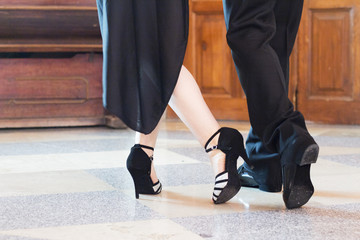 Legs of man and woman dancing Argentine tango