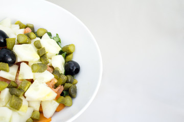 Spinach, tomato, cucumber, black olives and sweet and sour pickles salad