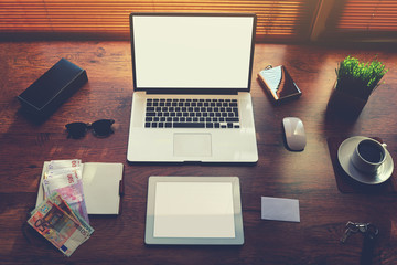 Top view of modern businessman or entrepreneur table with style accessories and euro bills, open laptop computer and digital tablet with white blank copy space screen for text information or content