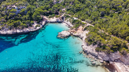 Beautiful aerial view of Mediterranean white sand beach and turquoise water in Menorca Spain, Cala Mitjana, aerial top view drone photo