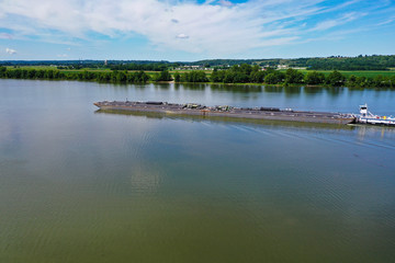 River barge traveling down the Ohio River by Cincinnati, Ohio and Northern Kentucky
