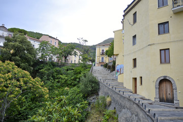 A narrow street among the old houses of Tortora, a rural village in the Calabria region, Italy.