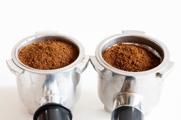 Portafilters filled with ground coffee