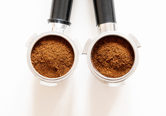 Portafilters filled with ground coffee