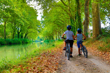 children with bike, Canal du midi in France