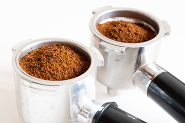 Portafilters filled with ground coffee