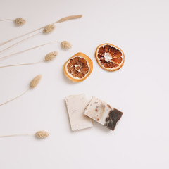 Flat lay composition with natural handmade soap and ingredients. Beautiful spa composition on a table top view.