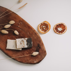 Flat lay composition with natural handmade soap and ingredients. Beautiful spa composition on a table top view.