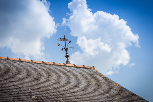 Weathercock on the roof of a traditionnal home
