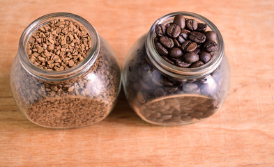 Fototapeta na wymiar Variety of coffee, coffee beans and instant coffee in glass jars. Kind of coffee. Space for text. 