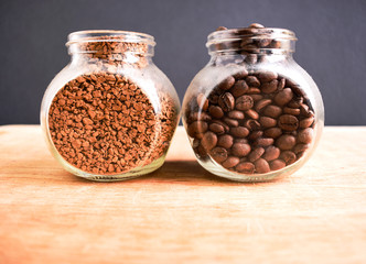 Variety of coffee, coffee beans and instant coffee in glass jars. Kind of coffee. Space for text. 