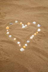 Fototapeta na wymiar heart on sand