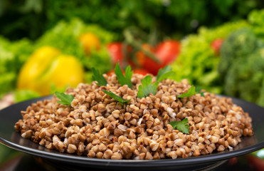 Cooked buckwheat porridge, served with herbs and vegetables