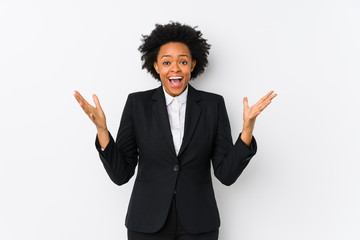 Middle aged african american business  woman against a white background isolated celebrating a...