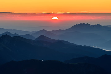 Fototapeta na wymiar A picture of the sunrise over the alpine moutains range in Germanyfrom highest peak Zugspitze. 