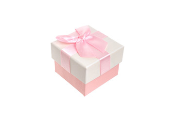 Obraz premium Beige gift box with a delicate pink engagement bow. Present for a birthday holiday, a Christmas event and a romantic greeting. Closeup studio shot on white background isolate.