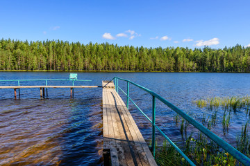 Fototapeta premium Picturesque forest lake, beautiful summer view. Vyaryamyanselkya ridge - environmental route in Leningradskaya oblast, Russia
