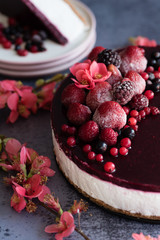 Sliced No Bake Strawberry Cheesecake Decorated with frozen Berries