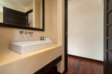 Interior design of house, home, villa, condo and apartment feature sink with towels, mirror and tap