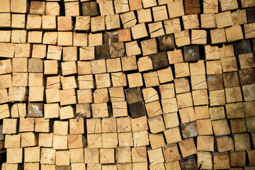 Wall of wooden square logs for background