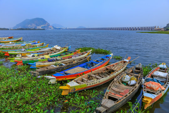 Vijayawada, INDIA - January 6 2019 : Old colorful fishermen boats on the banks of river Krishna at Vijayawada, India
