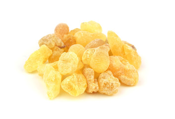 Closeup on Frankincense (Olibanum). High Grade Yellow Aroma Resin Gum. Isolated on White Background.